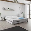 A bedroom scene with a bed, nightstand, and dresser. Náhľad obrázku produktu