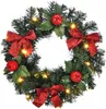 A Christmas wreath decorated with red bows, red apples, and LED lights. Produktbild-Vorschau