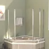 A corner bathtub with a glass shower enclosure and a towel hanging on a rack. Produktbild-Vorschau