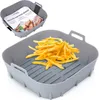A gray silicone air fryer basket filled with french fries, with a smaller basket in the background showing product packaging. Náhľad obrázku produktu