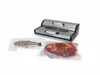 A vacuum sealer machine with a fish and a large cut of meat packaged next to it. Podgląd zdjęcia produktu