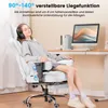 A woman is relaxing in a white gaming chair with headphones on, next to a desk with a computer. Náhľad obrázku produktu