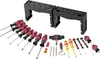A collection of screwdrivers and other tools arranged on a white background, with two black tool holders in the background. Podgląd zdjęcia produktu
