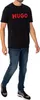 A man wearing a black t-shirt with a red logo and blue jeans. Produktbild-Vorschau