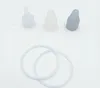 Three silicone bottle nipples of different shades of white and gray, and two silicone rings. Anteprima dell’immagine prodotto