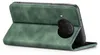 A green flip case for a smartphone is shown from the side, with the case open. Produktbild-Vorschau