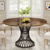 A round dining table with a wooden top and a black metal base, set in a dining room with chairs and a window in the background. Podgląd zdjęcia produktu