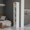 A tall, narrow white bookshelf stands next to a kitchen counter and sink, with a brown leather sofa and a blanket in the foreground. Produktbild-Vorschau