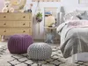 A cozy bedroom scene with a bed, dresser, and decorative items. Náhled obrázku produktu