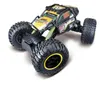 A remote-controlled rock crawler car is shown from a slightly elevated front-side angle against a white background. Voir les images du produit