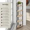 A corner shelf unit displayed next to a window, with decorative items on its shelves. Náhled obrázku produktu