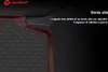 Close-up of a car floor mat with raised edges, showing a textured surface and a red grid overlay highlighting the edge feature. Text explains the feature. Produktbild-Vorschau