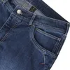 Ravage Jeans von Ocun; Herren Kletter- und Boulderhose in dunklem Denim; Detailansicht der Vorderseite mit Taschen und Knopf. Anteprima dell’immagine prodotto