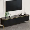 A black TV cabinet with gold accents and metal legs, shown in a modern living room setting with a wall-mounted TV and decorative items. Anteprima dell’immagine prodotto