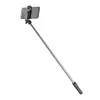 A selfie stick with a smartphone attached, extended and angled. Voir les images du produit