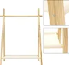 A wooden clothes rack with one shelf, shown against a white background. Produktbild-Vorschau