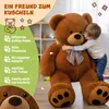 A child hugging a large teddy bear, with descriptive text and icons on the left side. Produktbild-Vorschau