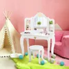 A child's play vanity set with a stool, placed in a pink-themed room with a teepee and a pink sofa. Podgląd zdjęcia produktu