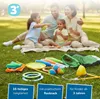 A family is having a picnic in a park, with a set of juggling toys laid out on the grass in the foreground. Podgląd zdjęcia produktu