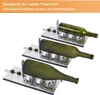 Three glass bottles are placed on metal cutting jigs, ready to be cut. Produktbild-Vorschau