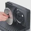 A hand is shown inserting a circular blade into a black electric slicer. Produktbild-Vorschau
