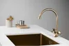 A close-up shot of a kitchen sink faucet and sink. Produktbild-Vorschau