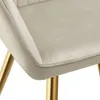A close-up view of a beige upholstered chair with gold legs. Náhled obrázku produktu