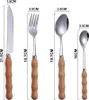A size chart showing four pieces of cutlery with dimensions indicated by text and lines. Voir les images du produit
