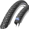 Two bicycle tires are shown against a white background. One tire is in the foreground and angled, while the other is slightly behind and to the right, also angled. A cutaway view of the second tire reveals its internal structure and a blue sealant. Podgląd zdjęcia produktu