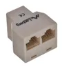 A beige network adapter with two RJ45 ports. Náhľad obrázku produktu
