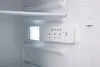 Interior view of a refrigerator with a control panel and a shelf. Produktbild-Vorschau