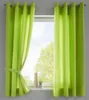 Two lime green curtains are shown hanging in front of a window. The curtains are tied back on the left side with a fabric tie. Produktbild-Vorschau