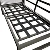 Close-up view of the base of a sofa or lounge chair, showing the metal frame and black woven straps that form the seating surface. Produktbild-Vorschau
