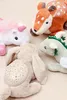 A collection of plush toys, including a unicorn, a deer, a dragon, and a bunny, are arranged on a textured surface. Anteprima dell’immagine prodotto