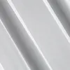 A close-up abstract view of white fabric with diagonal folds and light. Produktbild-Vorschau