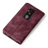 A burgundy flip case for a smartphone is shown from a diagonal top-down view on a white background. Produktbild-Vorschau