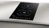 A black induction cooktop with two burners is shown on a light gray countertop. Podgląd zdjęcia produktu