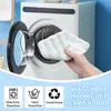 A hand holds a cleaning cloth in front of an open washing machine. Produktbild-Vorschau