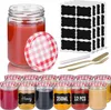A set of glass jars with red and white checkered lids, along with labels and a pen, are displayed on a white background. Produktbild-Vorschau
