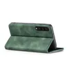 A green flip case for a smartphone is shown from a side-angle, with the case open and the phone inside. Produktbild-Vorschau