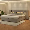 A bedroom scene featuring a large upholstered bed with integrated lighting and storage. Produktbild-Vorschau
