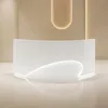 A modern, curved white reception desk with integrated lighting, set against a neutral beige wall and floor. Anteprima dell’immagine prodotto
