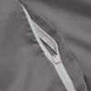 A close-up view of a zipper on a gray fabric. Produktbild-Vorschau