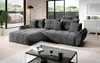 A modern gray sectional sofa is displayed in a well-lit living room with large windows overlooking an outdoor patio. Náhled obrázku produktu
