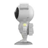 A white astronaut figurine on a gray base, shown from the side. Produktbild-Vorschau