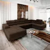 A spacious living room with a large sectional sofa, coffee table, and abstract art on the wall. Produktbild-Vorschau