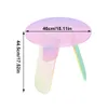 A small, round, iridescent acrylic side table with three legs, shown against a white background. Dimensions are indicated with text overlays. Anteprima dell’immagine prodotto