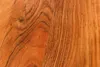 A close-up view of the natural wood grain of a desk. Produktbild-Vorschau