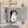 A cat is resting inside a grey cat tree with a text overlay. Produktbild-Vorschau