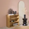 A wooden bookshelf with decorative items and books, placed against a pink wall with an arched mirror in the background. Anteprima dell’immagine prodotto